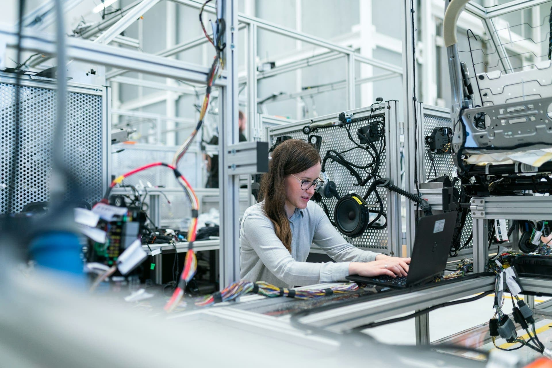 Engineers working with industrial equipment in a workshop
